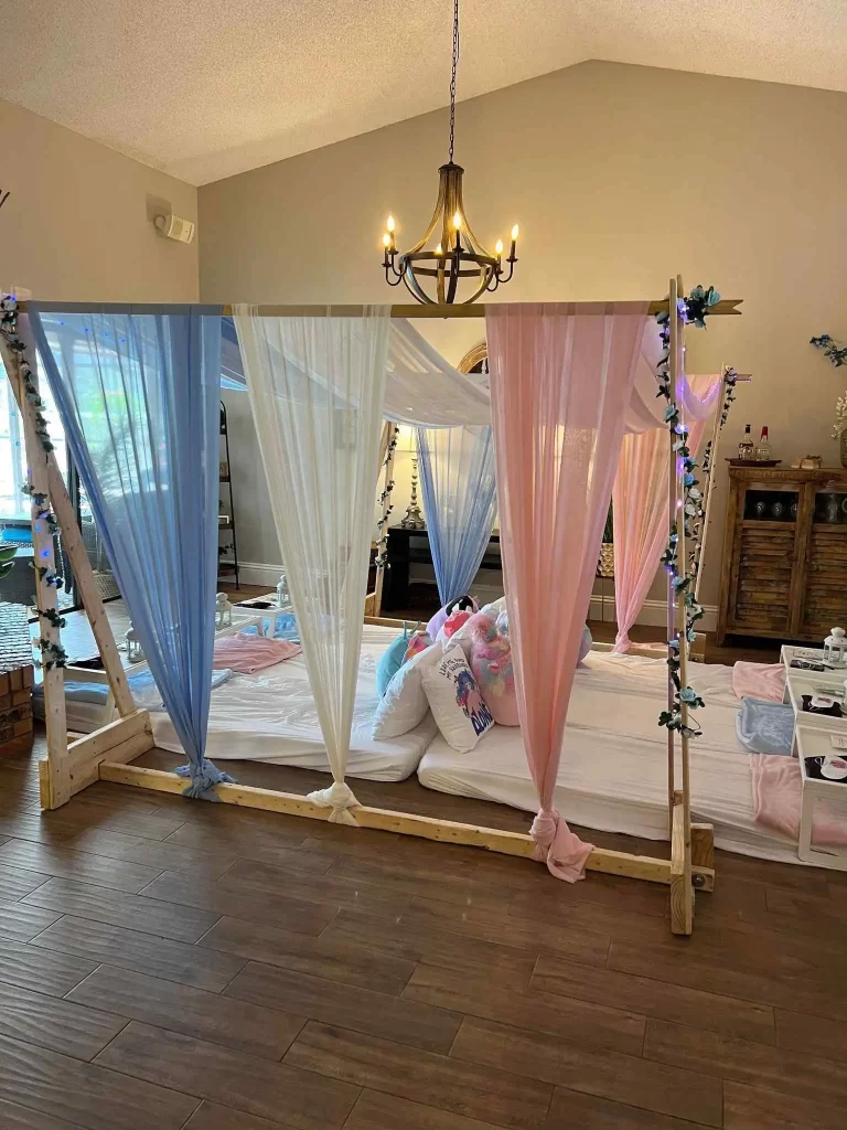 A pink and blue canopy tent in a living room, perfect for a Texas party rental.